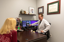 Dr Foust during an implant consultation.